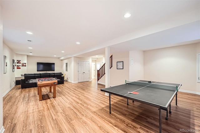 recreation room with light hardwood / wood-style flooring