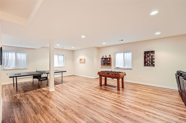 playroom with light hardwood / wood-style flooring