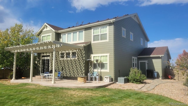 back of house featuring a patio, a lawn, central air condition unit, and a pergola