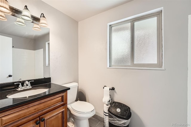 full bathroom with vanity and toilet