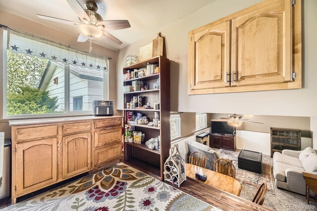 13661 W Tufts Ave, Morrison, CO 80465 - kitchen featuring a ceiling fan, open shelves, and a healthy amount of sunlight