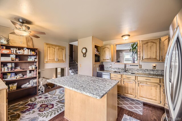 13661 W Tufts Ave, Morrison, CO 80465 - kitchen with a kitchen island, light stone counters, a sink, dark wood finished floors, and appliances with stainless steel finishes