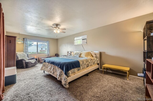 13661 W Tufts Ave, Morrison, CO 80465 - bedroom featuring baseboards, ceiling fan, carpet, and a wall unit AC