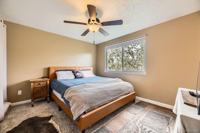 13661 W Tufts Ave, Morrison, CO 80465 - bedroom featuring baseboards and ceiling fan