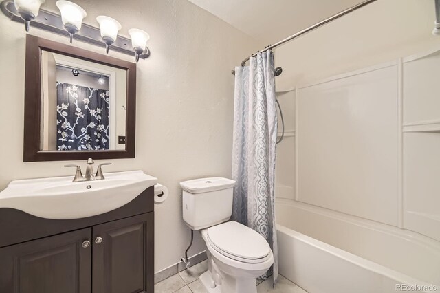 13661 W Tufts Ave, Morrison, CO 80465 - bathroom featuring tile patterned floors, vanity, toilet, and shower / bath combination with curtain