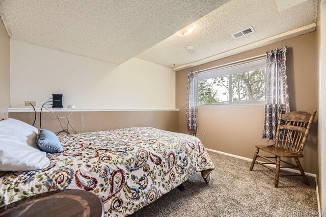 13661 W Tufts Ave, Morrison, CO 80465 - carpeted bedroom featuring a textured ceiling, visible vents, and baseboards