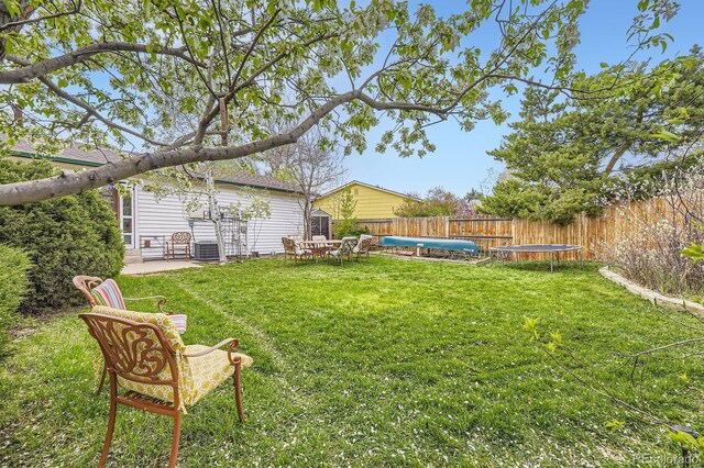 13661 W Tufts Ave, Morrison, CO 80465 - view of yard featuring a fenced backyard and central air condition unit