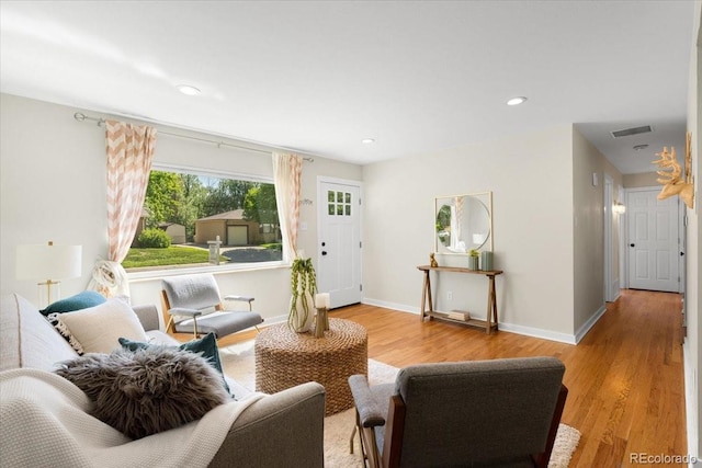 6314 Brooks Dr, Arvada, CO 80004 - living area with wood finished floors, baseboards, and recessed lighting