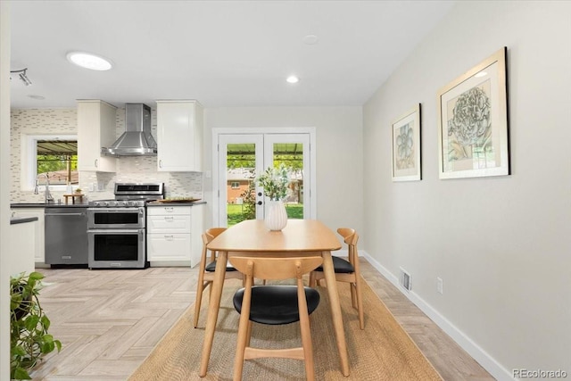 6314 Brooks Dr, Arvada, CO 80004 - dining space featuring french doors and baseboards