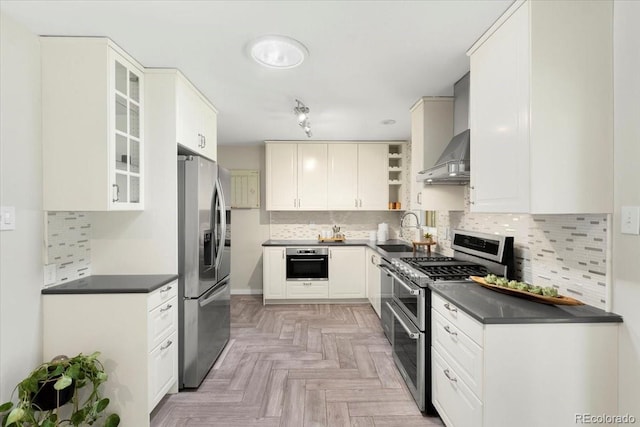6314 Brooks Dr, Arvada, CO 80004 - kitchen with stainless steel appliances, dark countertops, a sink, and tasteful backsplash
