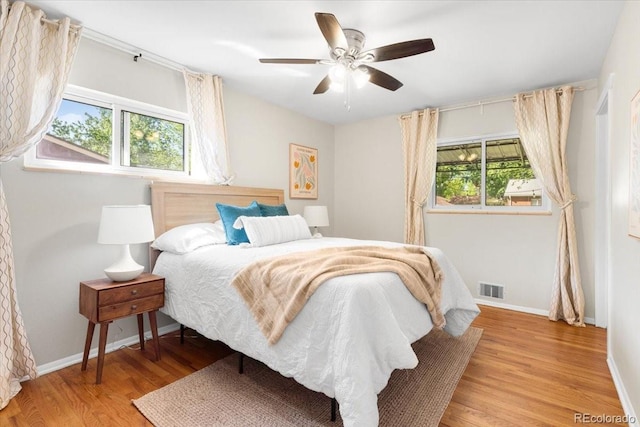 6314 Brooks Dr, Arvada, CO 80004 - bedroom featuring wood finished floors, baseboards, and a ceiling fan
