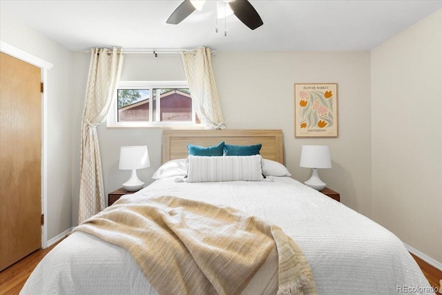 6314 Brooks Dr, Arvada, CO 80004 - bedroom featuring wood finished floors, a ceiling fan, and baseboards