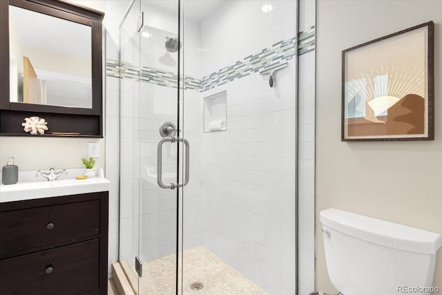 6314 Brooks Dr, Arvada, CO 80004 - bathroom with a stall shower, toilet, and vanity