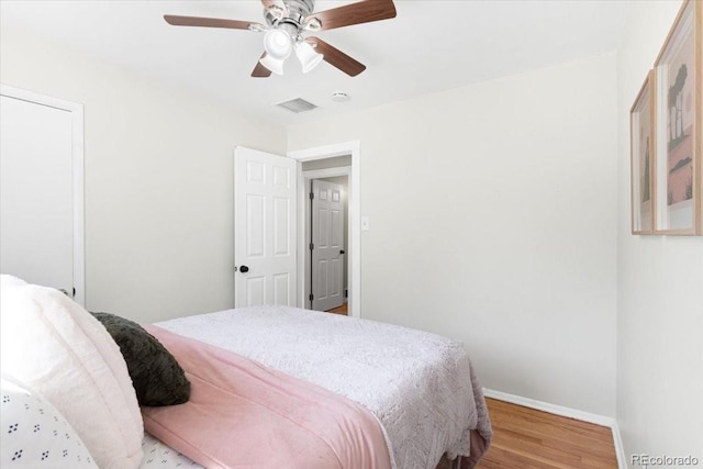 6314 Brooks Dr, Arvada, CO 80004 - bedroom with baseboards, wood finished floors, and a ceiling fan