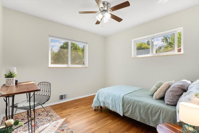 6314 Brooks Dr, Arvada, CO 80004 - bedroom with light wood-style floors, baseboards, and a ceiling fan