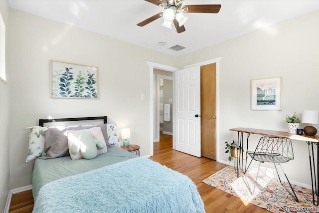 6314 Brooks Dr, Arvada, CO 80004 - bedroom with wood finished floors, baseboards, and a ceiling fan
