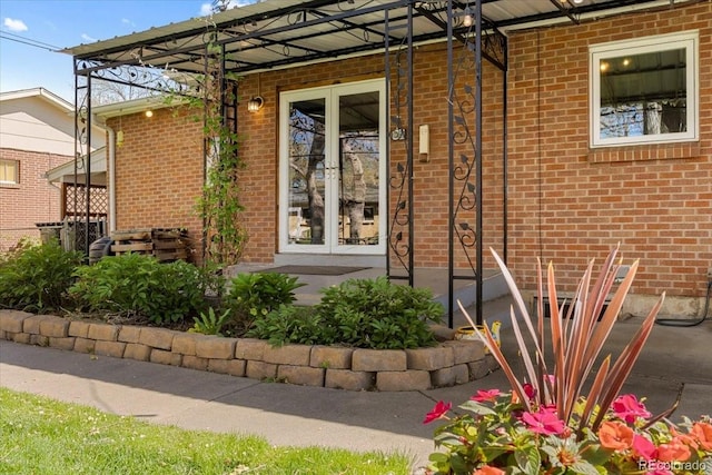 6314 Brooks Dr, Arvada, CO 80004 - property entrance with brick siding and french doors