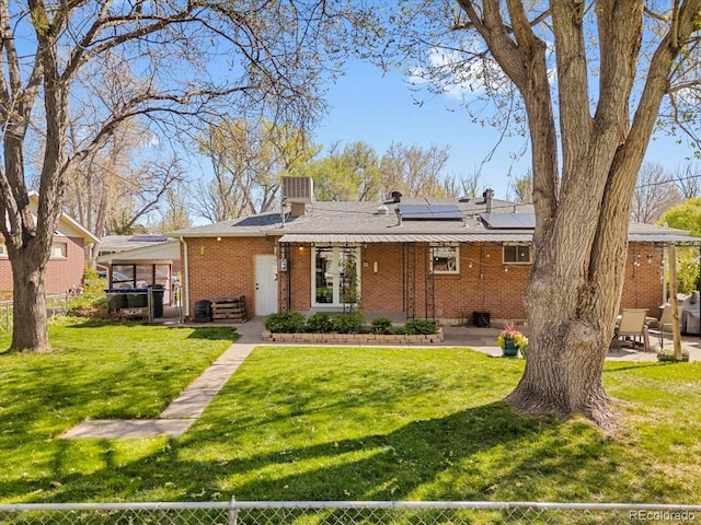 6314 Brooks Dr, Arvada, CO 80004 - single story home featuring a patio, brick siding, and solar panels