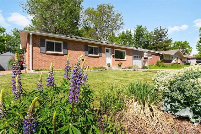 6314 Brooks Dr, Arvada, CO 80004 - ranch-style home featuring brick siding, a garage, and a front lawn