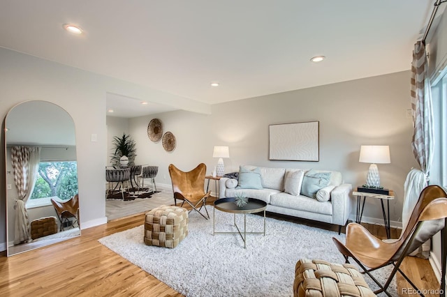 6314 Brooks Dr, Arvada, CO 80004 - living room featuring recessed lighting, light wood-style flooring, and arched walkways