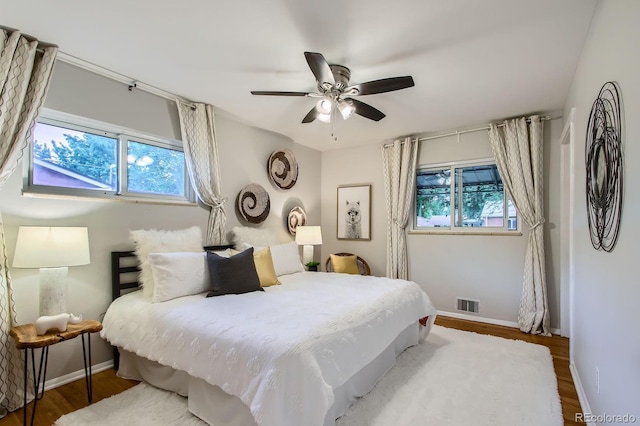 6314 Brooks Dr, Arvada, CO 80004 - bedroom with wood finished floors and a ceiling fan