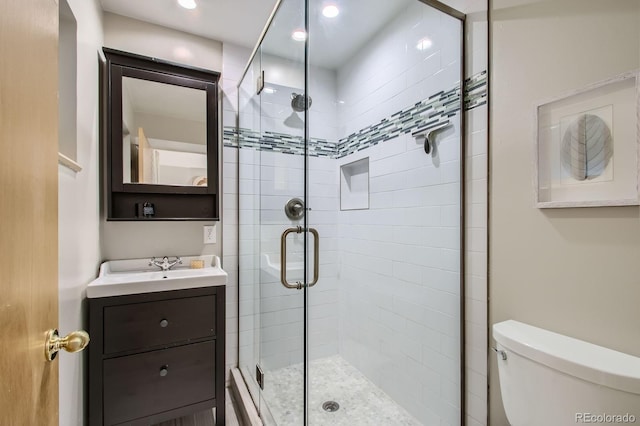 6314 Brooks Dr, Arvada, CO 80004 - full bath featuring a shower stall, vanity, and recessed lighting