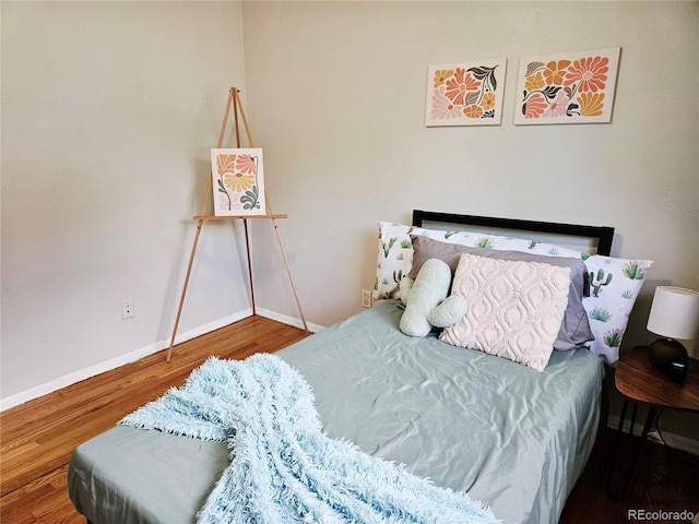 6314 Brooks Dr, Arvada, CO 80004 - bedroom featuring wood finished floors and baseboards
