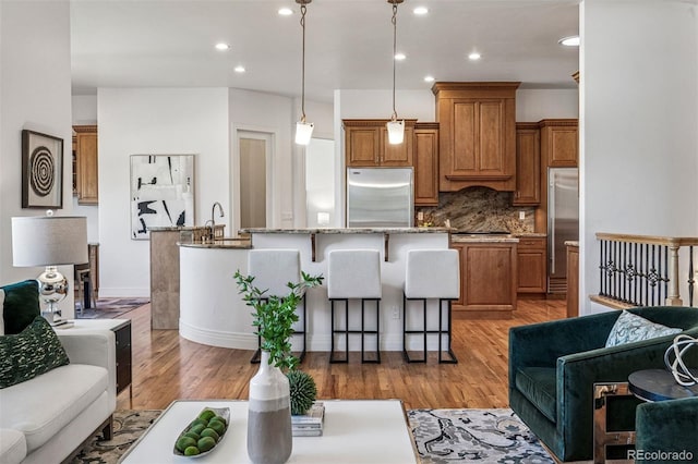 13962 W 76th Ln, Arvada, CO 80005 - living area featuring recessed lighting and light wood-style floors