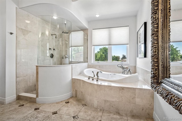 13962 W 76th Ln, Arvada, CO 80005 - bathroom with a garden tub, a walk in shower, and tile patterned flooring