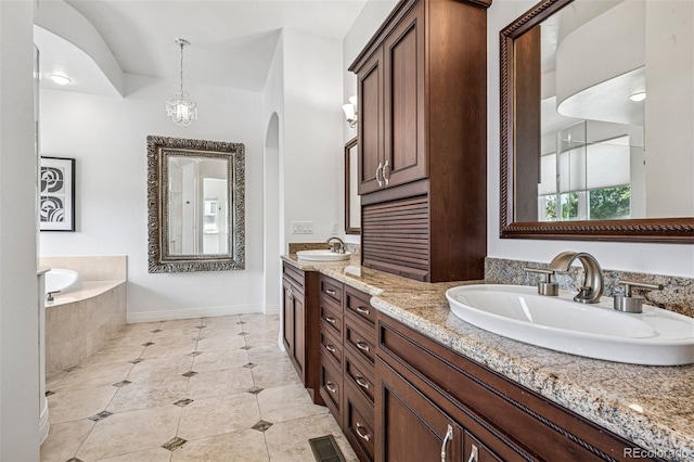 13962 W 76th Ln, Arvada, CO 80005 - bathroom with double vanity, tile patterned floors, and a bath