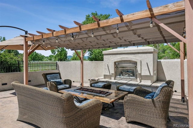 13962 W 76th Ln, Arvada, CO 80005 - view of patio / terrace with an outdoor living space with a fireplace and a pergola