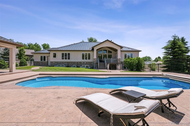 13962 W 76th Ln, Arvada, CO 80005 - view of swimming pool featuring stairway and a patio