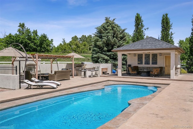 13962 W 76th Ln, Arvada, CO 80005 - view of swimming pool with a storage structure, an outdoor kitchen, a patio area, an outbuilding, and a pergola