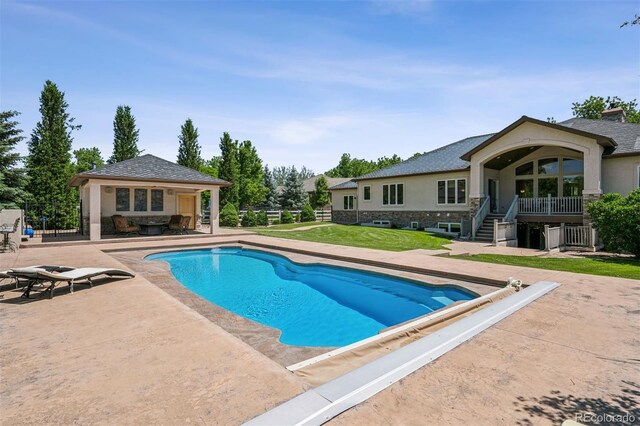 13962 W 76th Ln, Arvada, CO 80005 - view of swimming pool with a patio, an outdoor structure, a covered pool, and an exterior structure