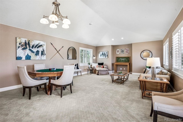 13962 W 76th Ln, Arvada, CO 80005 - dining space with a chandelier, lofted ceiling, and light colored carpet