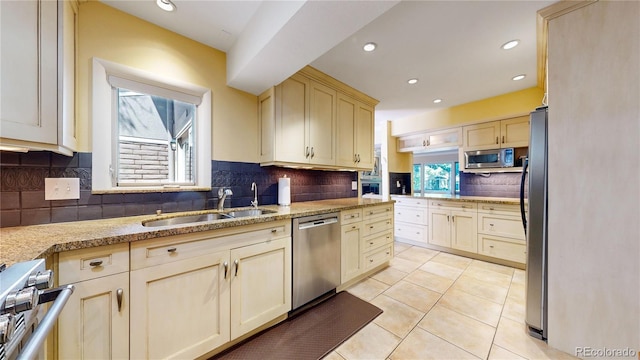 kitchen featuring tasteful backsplash, light tile patterned flooring, and stainless steel appliances