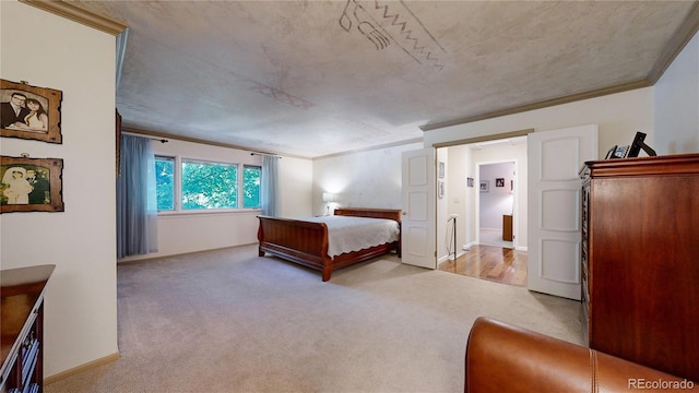 bedroom featuring crown molding and light carpet