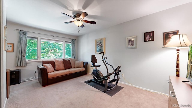 living room with light colored carpet and ceiling fan