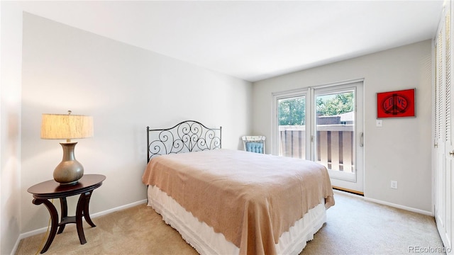 bedroom with light colored carpet