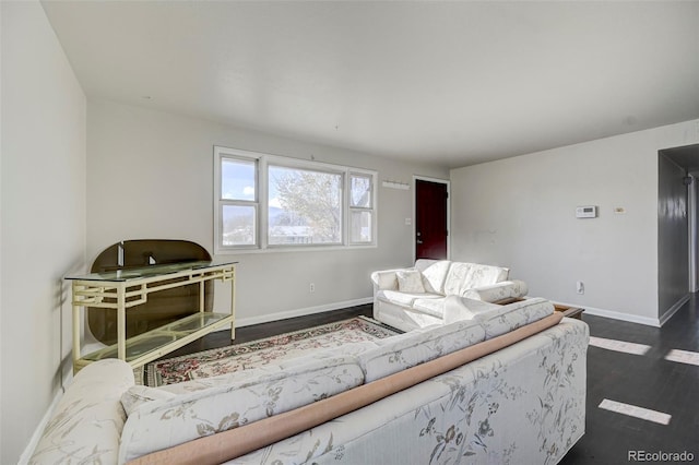 living room with dark hardwood / wood-style flooring