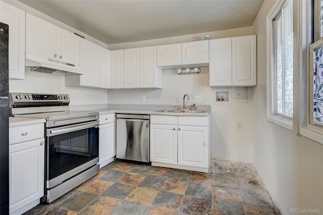 kitchen with white cabinets, stainless steel appliances, and sink