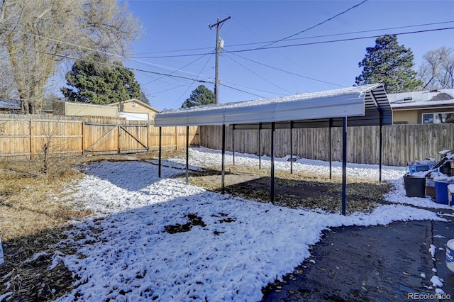 view of yard layered in snow