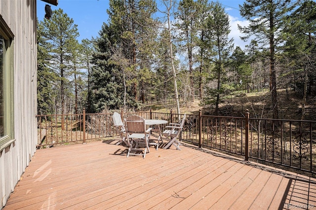 wooden deck featuring outdoor dining space
