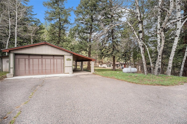 exterior space with an outdoor structure and a garage
