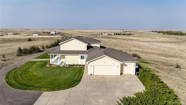 birds eye view of property featuring a rural view