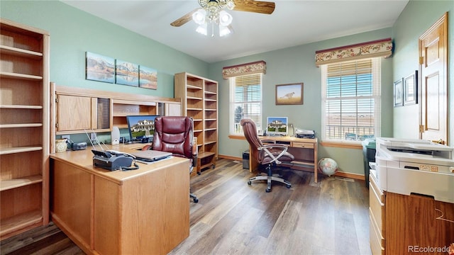 home office featuring wood-type flooring, ceiling fan, and a healthy amount of sunlight