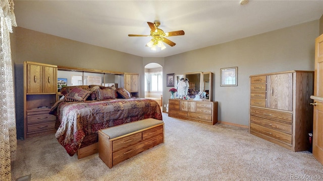 bedroom with light colored carpet and ceiling fan