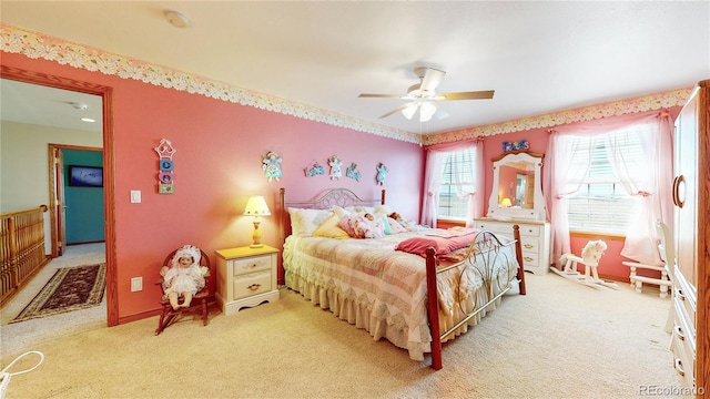 carpeted bedroom with ceiling fan