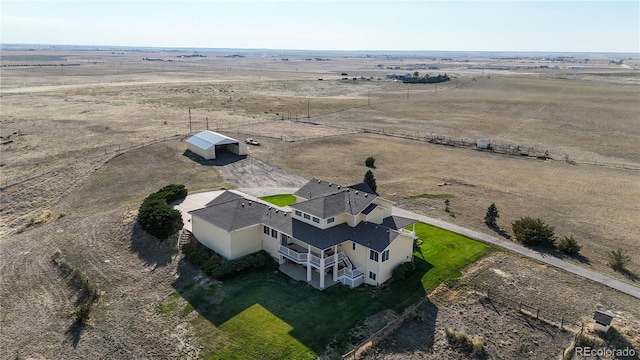 birds eye view of property featuring a rural view