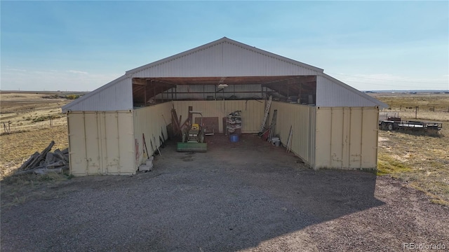 view of outbuilding with a rural view